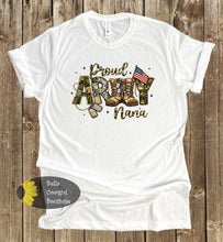 Load image into Gallery viewer, White t-shirt with 'Proud Army Nana' text and camouflage design on a wooden background