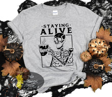 Load image into Gallery viewer, Staying Alive Coffee Skeleton Funny Halloween Women&#39;s T-Shirt

